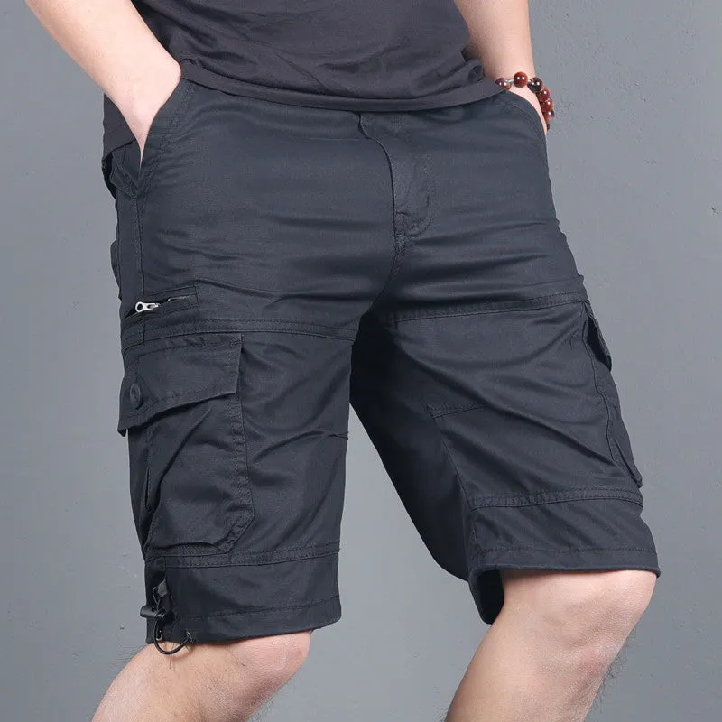 Green multi-pocket cotton cargo shorts with visible zippered side pocket, flat lay on white background