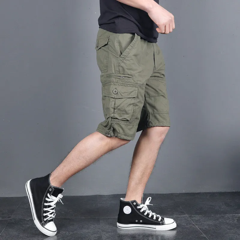 Green multi-pocket cotton cargo shorts with visible zippered side pocket, flat lay on white background