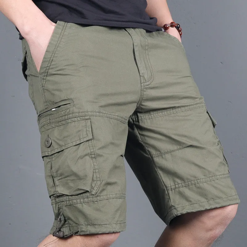 Green multi-pocket cotton cargo shorts with visible zippered side pocket, flat lay on white background