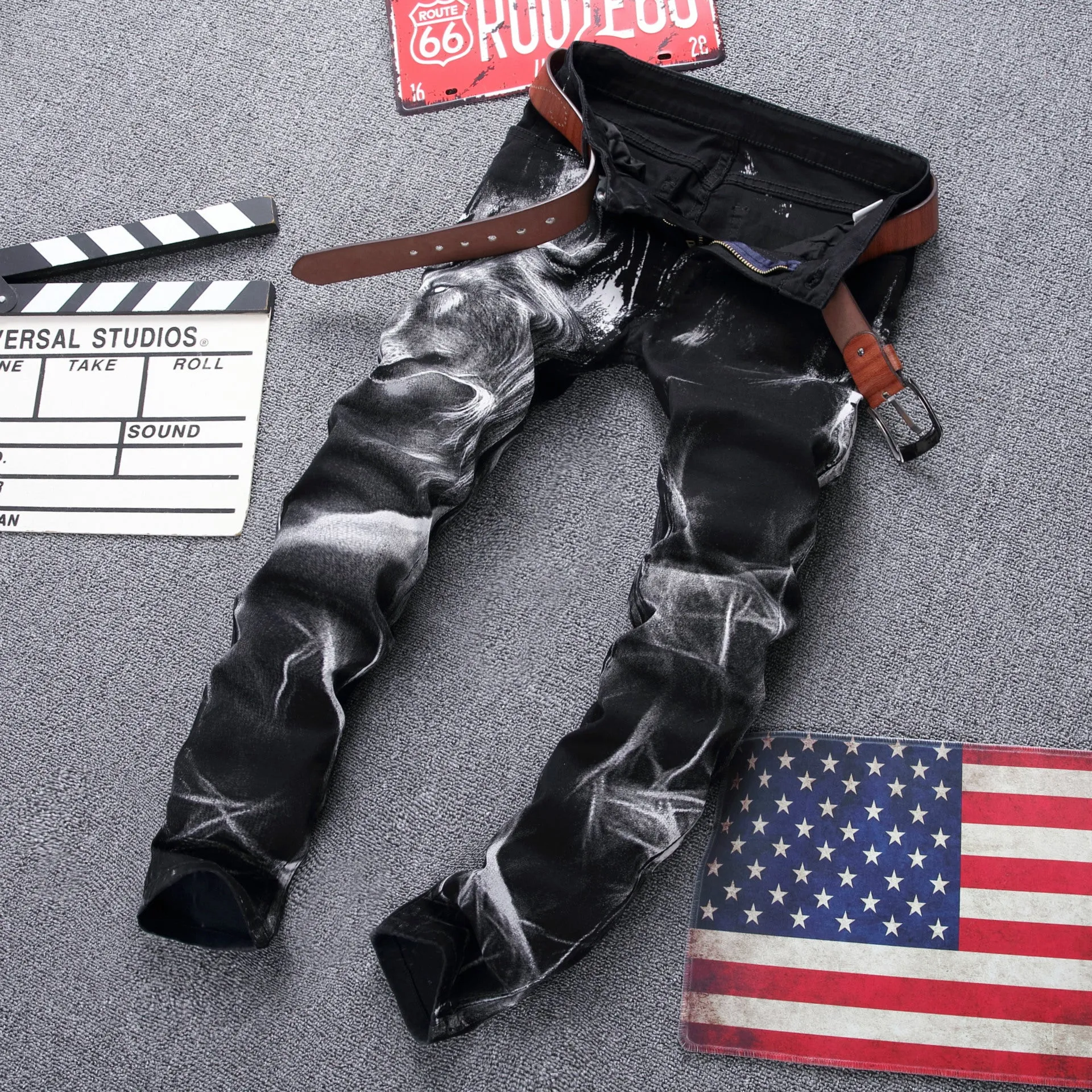 Men's black wolf print jeans with realistic wolf head design on cotton denim fabric