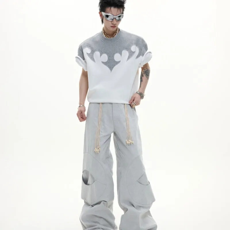 Grey loose-fit men's cotton shirt with short sleeves, drop shoulders, and a detailed burnt flower stitch pattern on the chest.