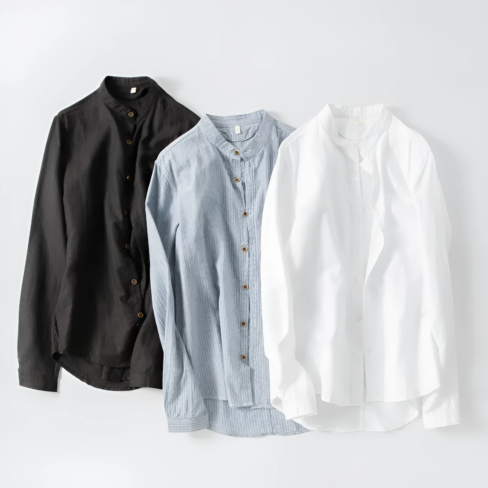White long sleeve cotton shirt with classic fit, collared neckline, and button front