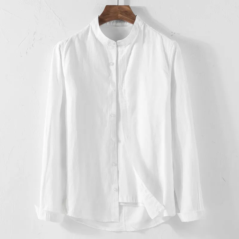 White long sleeve cotton shirt with classic fit, collared neckline, and button front