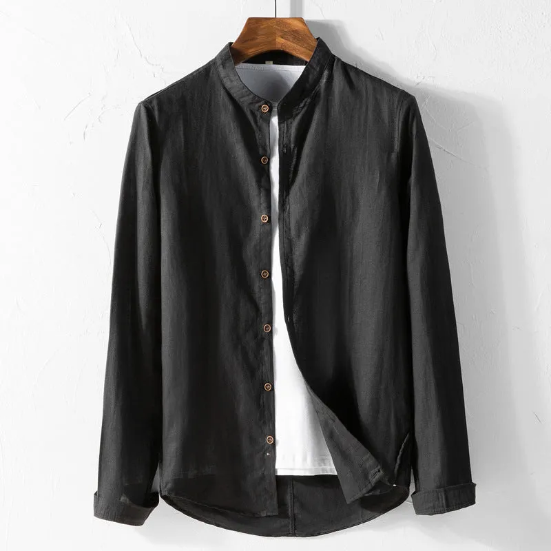 White long sleeve cotton shirt with classic fit, collared neckline, and button front