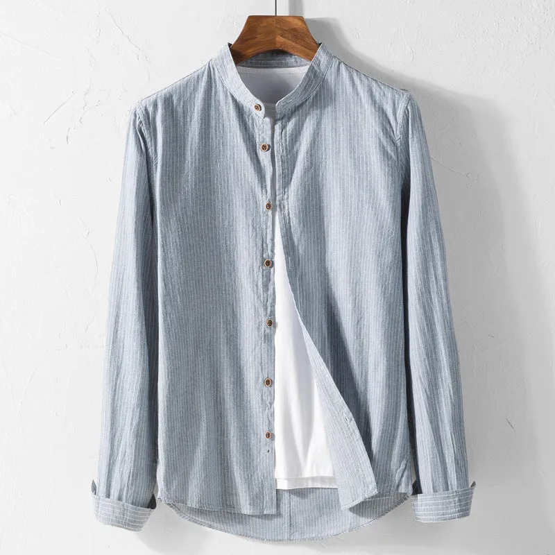 White long sleeve cotton shirt with classic fit, collared neckline, and button front