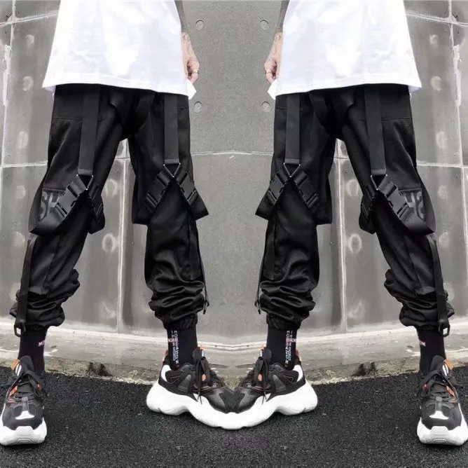 Black functional overalls for men with loose paratrooper-style fit and straight trousers, front view