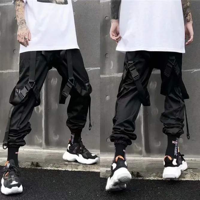 Black functional overalls for men with loose paratrooper-style fit and straight trousers, front view