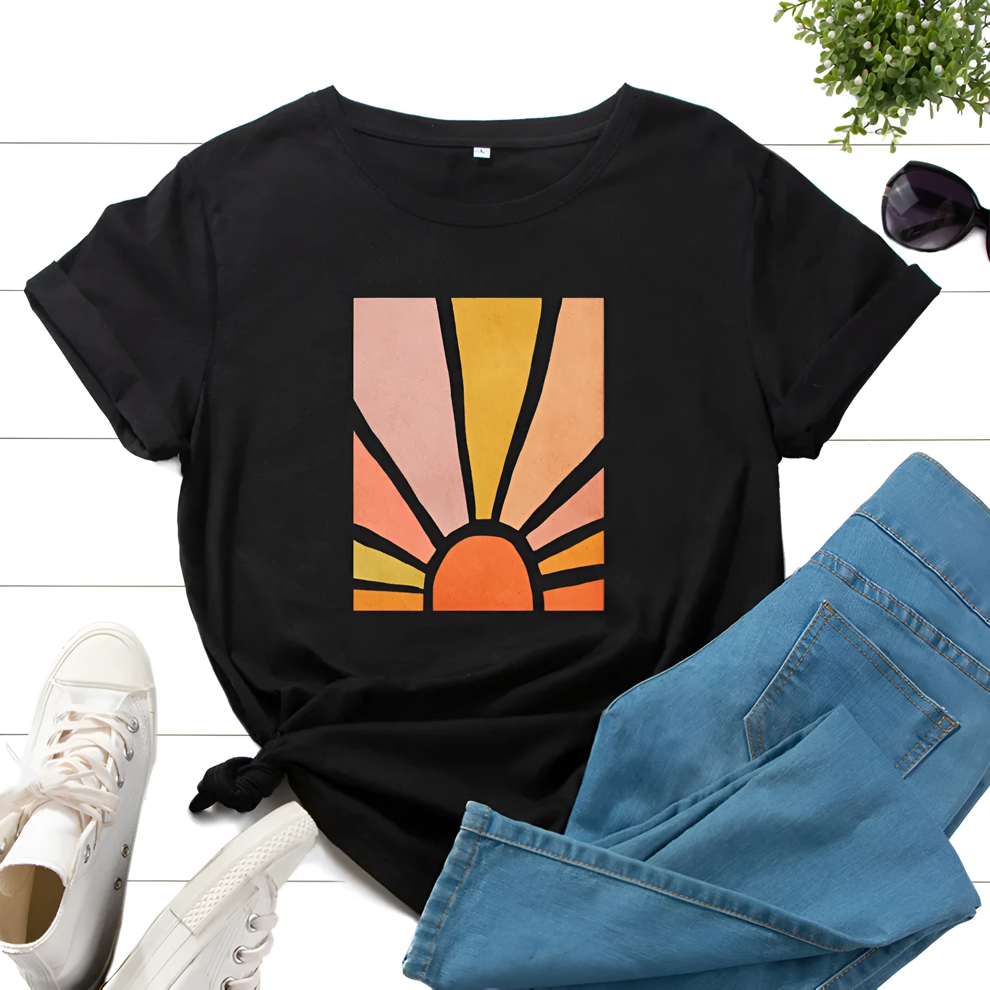 Women's cotton graphic tee with short sleeves and crew neck featuring a printed sun scenery and flower design