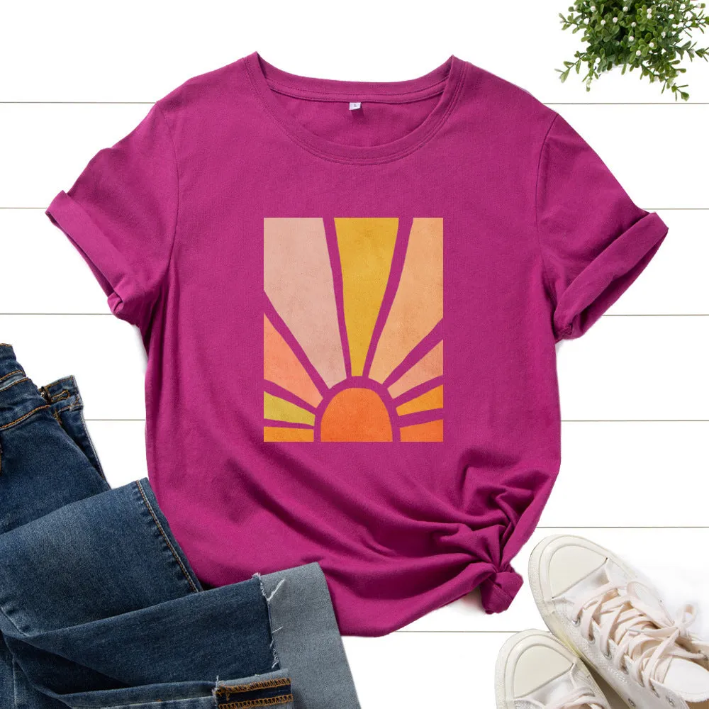 Women's cotton graphic tee with short sleeves and crew neck featuring a printed sun scenery and flower design