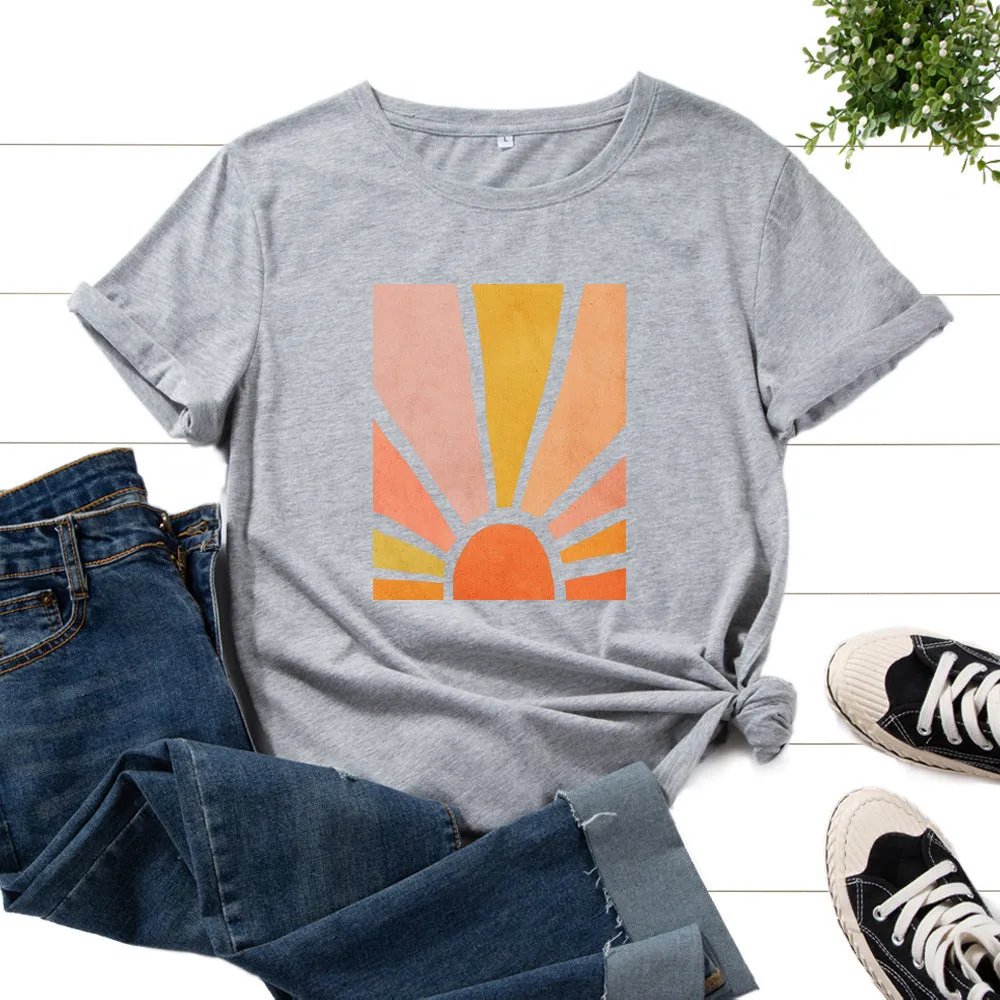 Women's cotton graphic tee with short sleeves and crew neck featuring a printed sun scenery and flower design