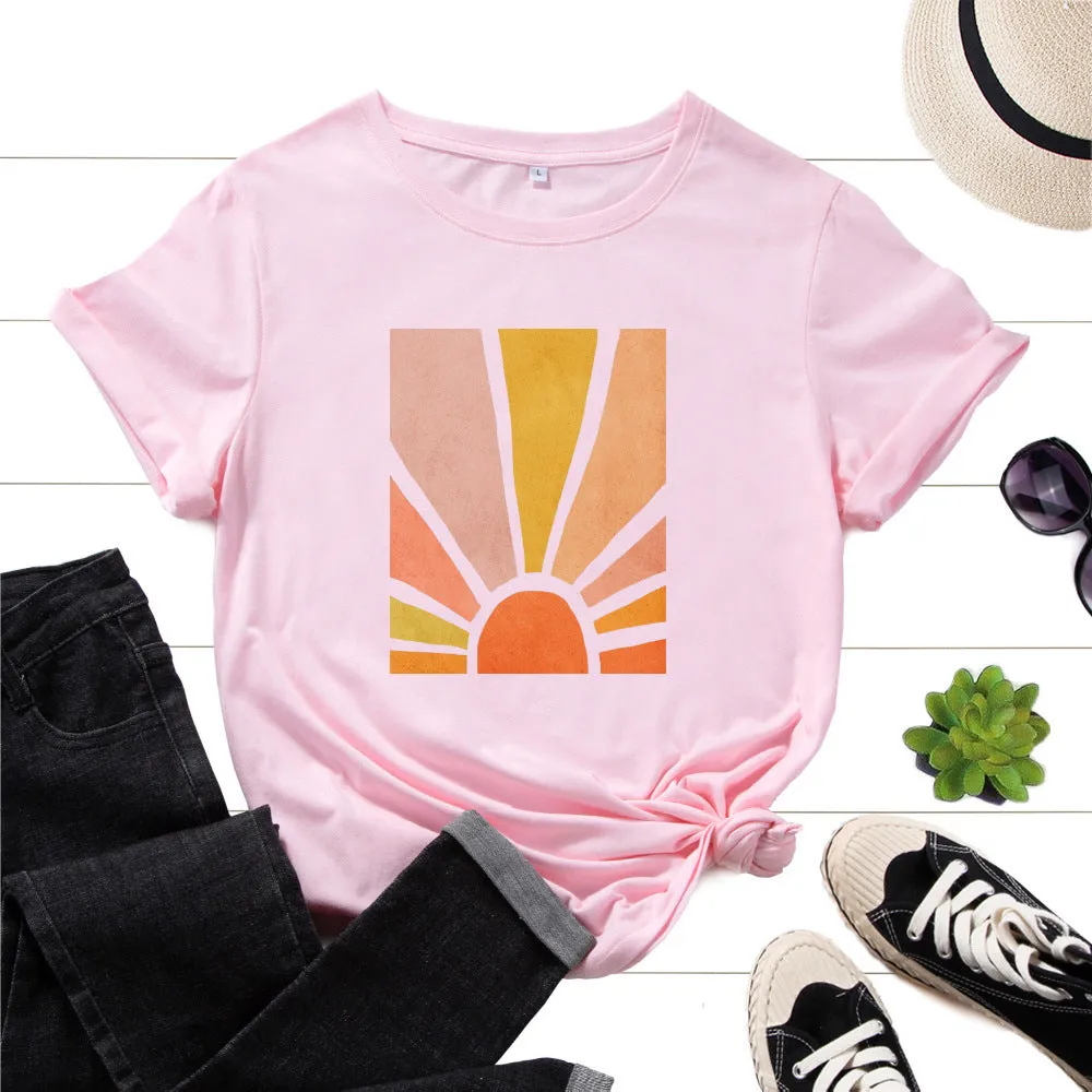 Women's cotton graphic tee with short sleeves and crew neck featuring a printed sun scenery and flower design