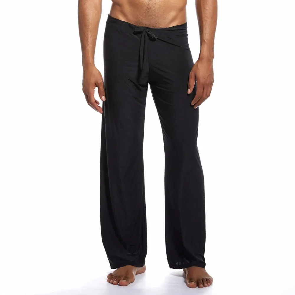Loose fit mid waist yoga trousers for women in silky fabric, available in black, brown, grey, white