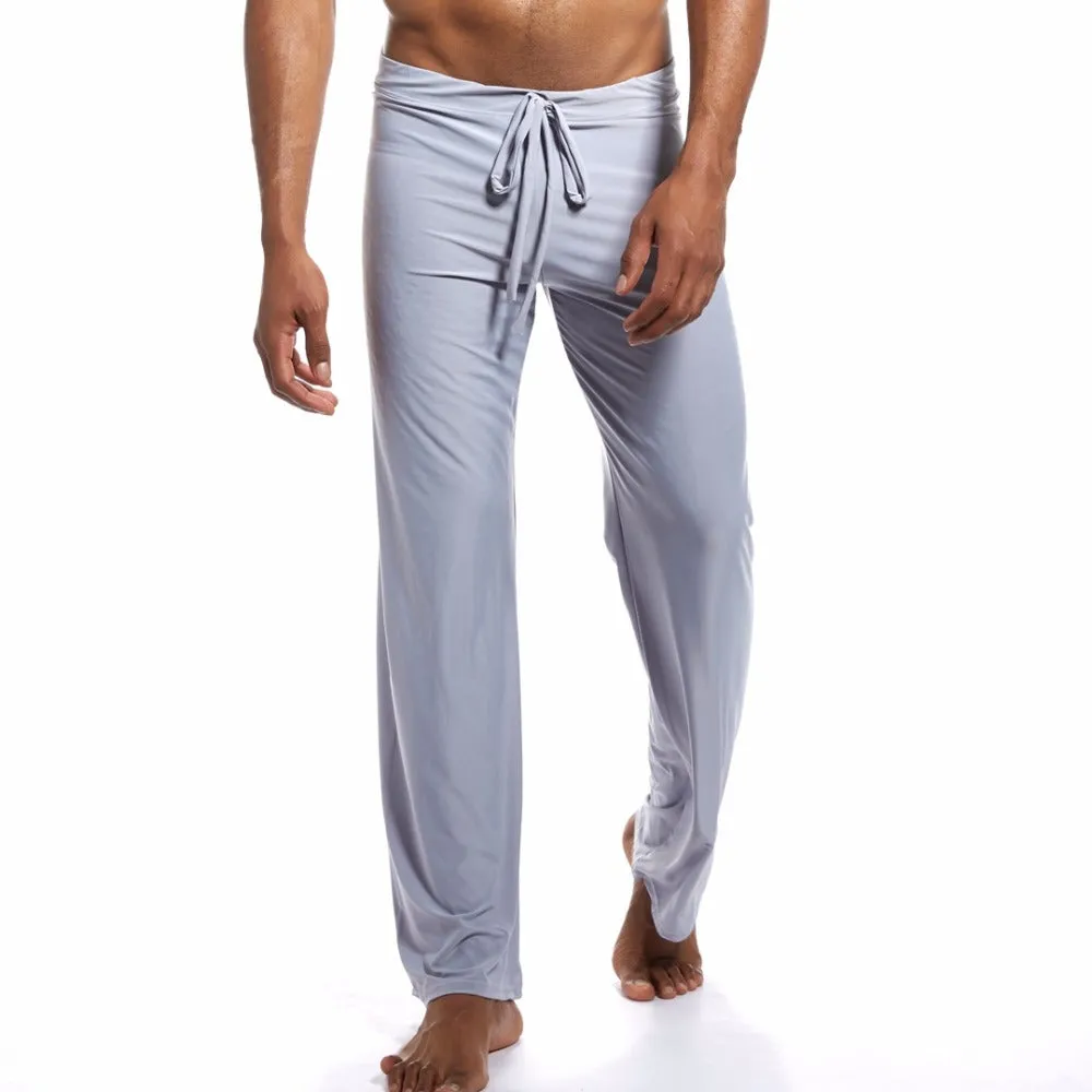 Loose fit mid waist yoga trousers for women in silky fabric, available in black, brown, grey, white