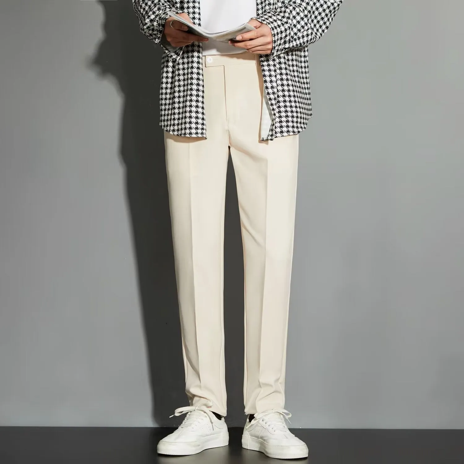 Men's straight cut ankle-length trousers in draping fabric showing apricot colour option