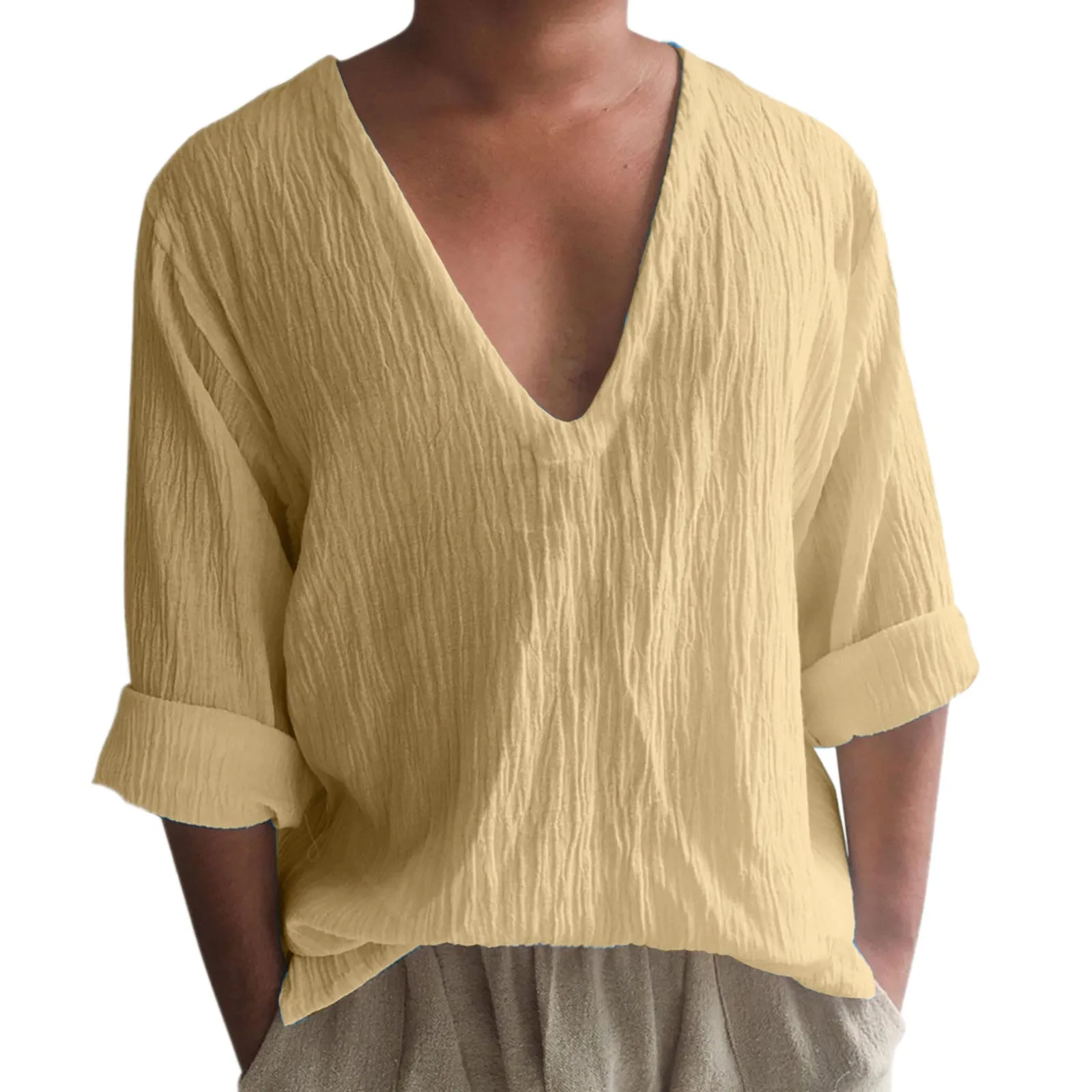 Man wearing a washed cotton long sleeve V-neck t-shirt in a solid colour.