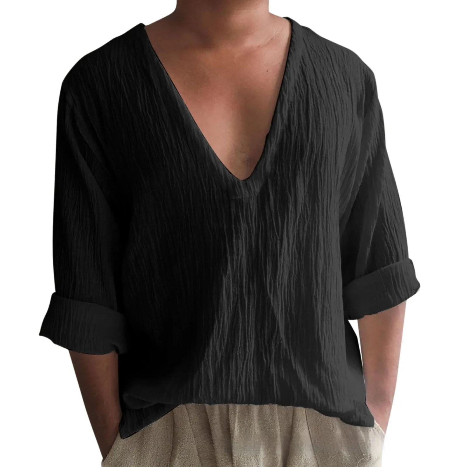 Man wearing a washed cotton long sleeve V-neck t-shirt in a solid colour.