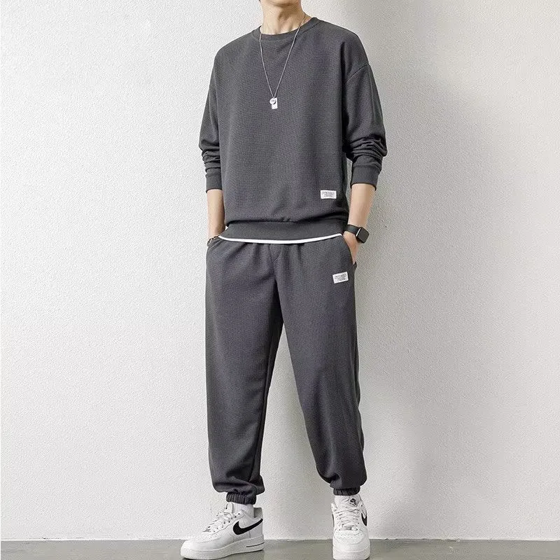 Long-sleeved waffle tracksuit set in nine colours, sizes L to 5XL, chemical fibre blend.