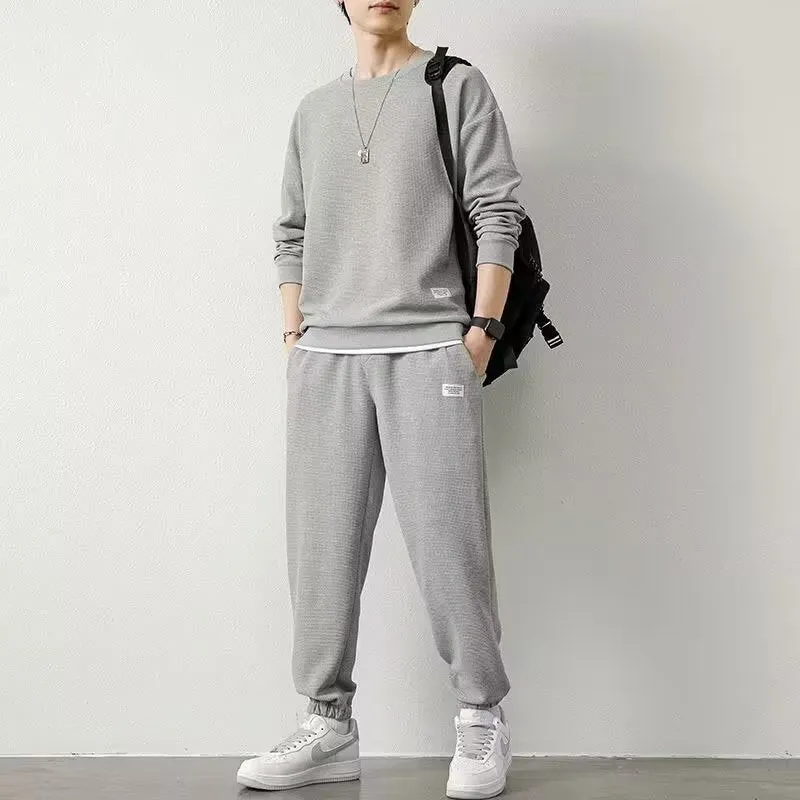 Long-sleeved waffle tracksuit set in nine colours, sizes L to 5XL, chemical fibre blend.