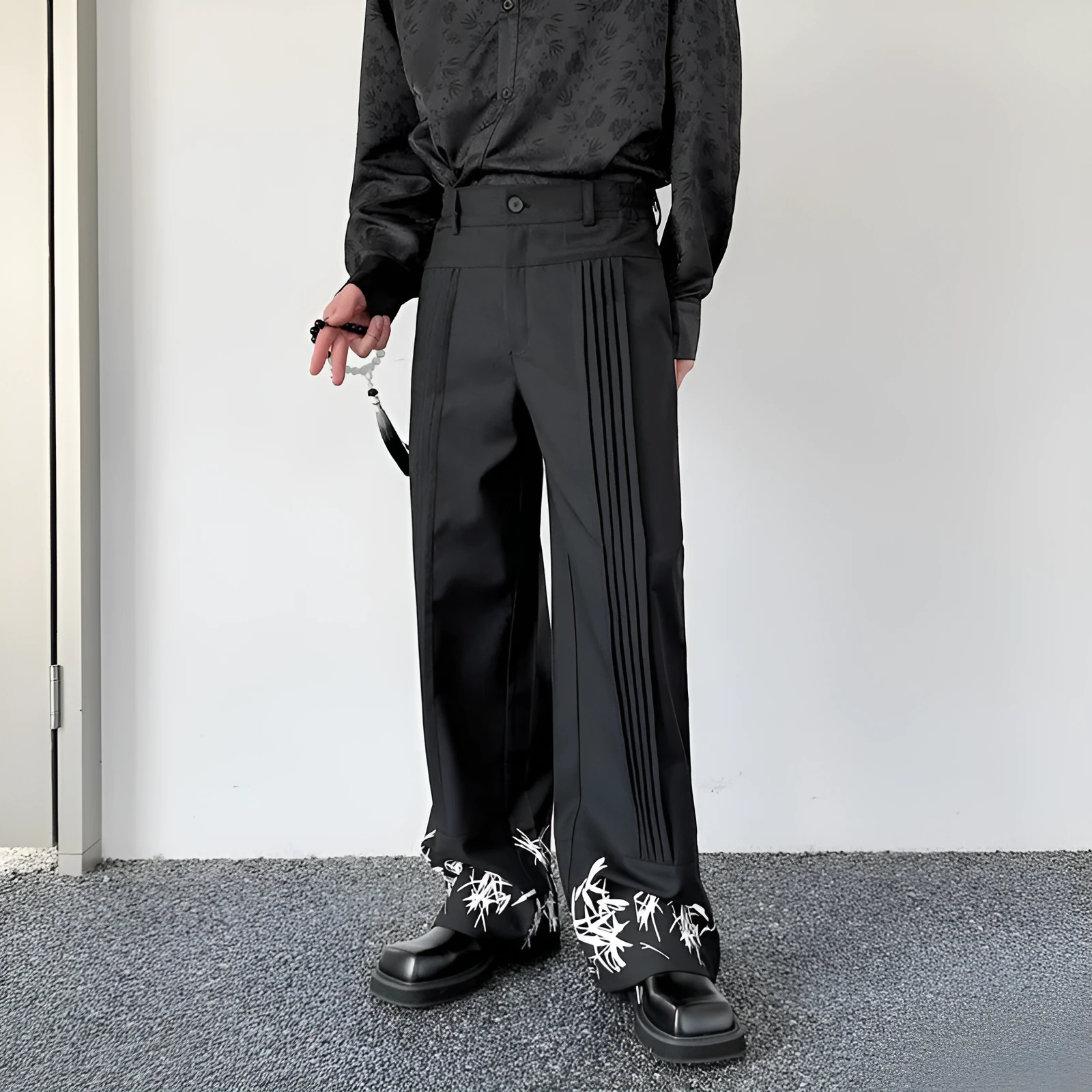 Pleated wide leg straight pants black cotton blend with elastic waist on mannequin