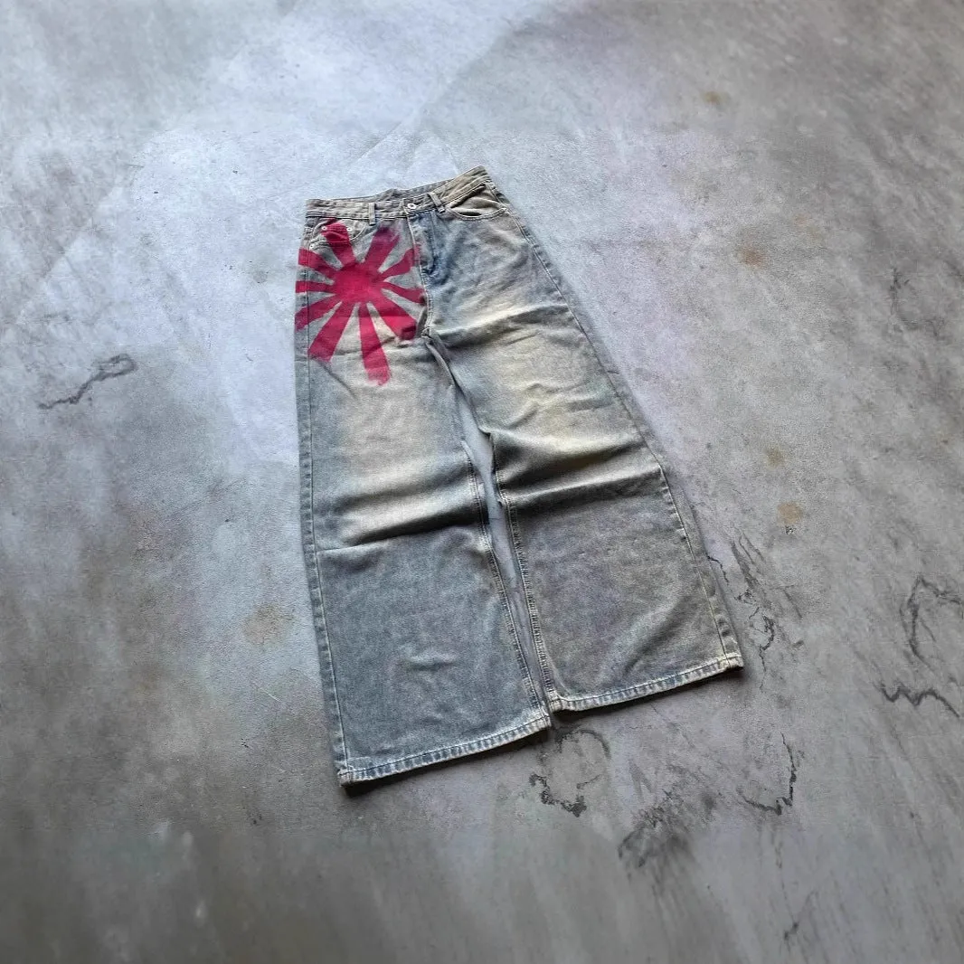 Men's wide-leg blue denim trousers with straight-leg cut and zipper fly, laid flat on a neutral background