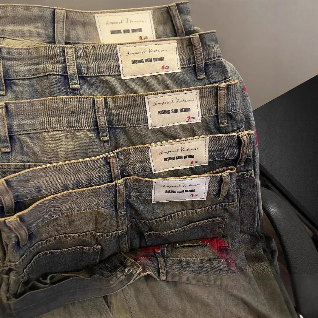 Men's wide-leg blue denim trousers with straight-leg cut and zipper fly, laid flat on a neutral background