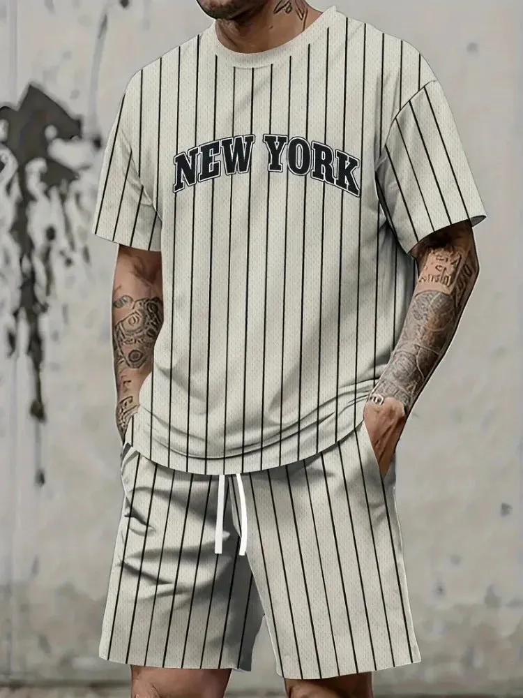 Men's grey 3D printed letter short sleeve top and matching shorts sportswear set laid flat.