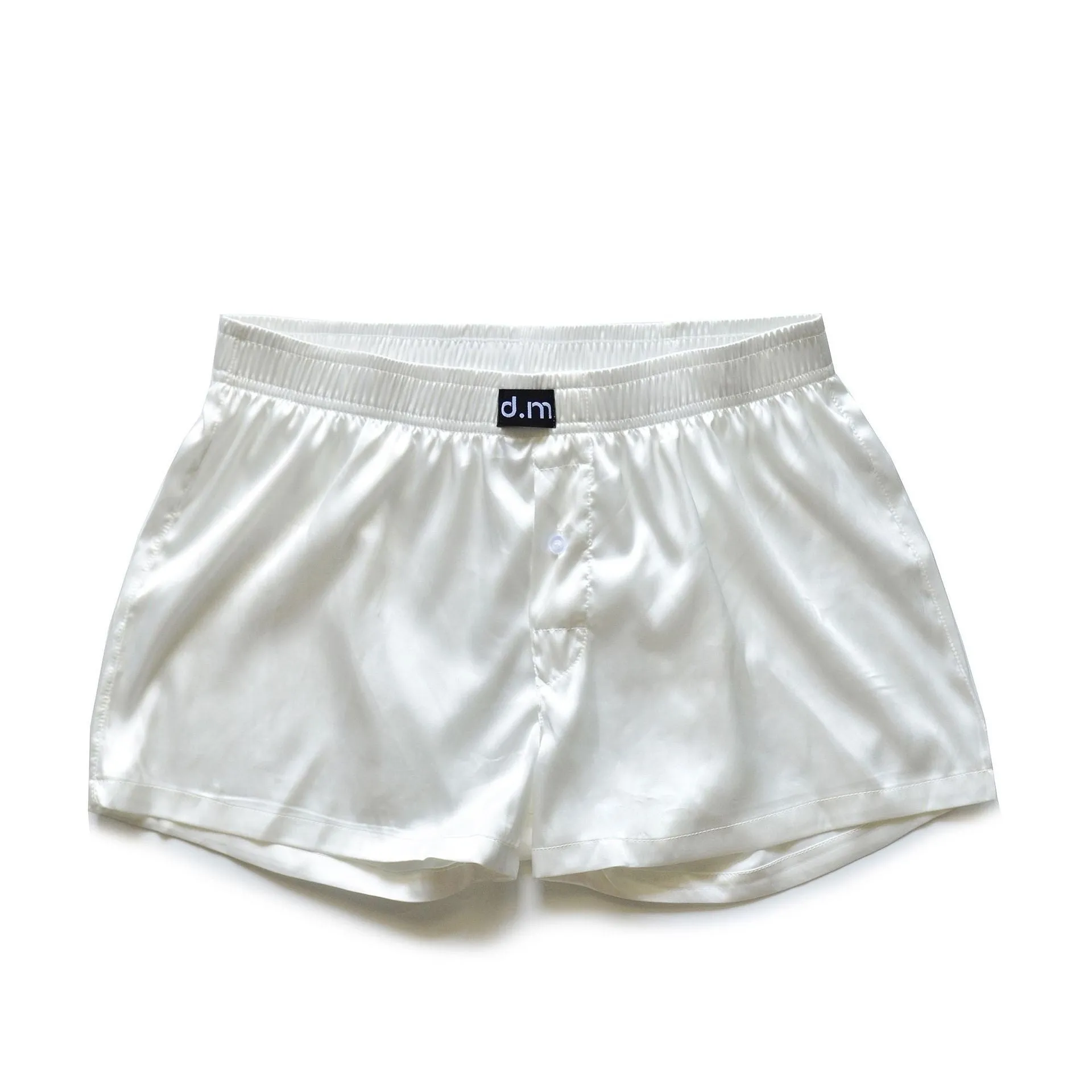 Men's low waist silky polyester boxer pajama shorts in black brown, front view on model