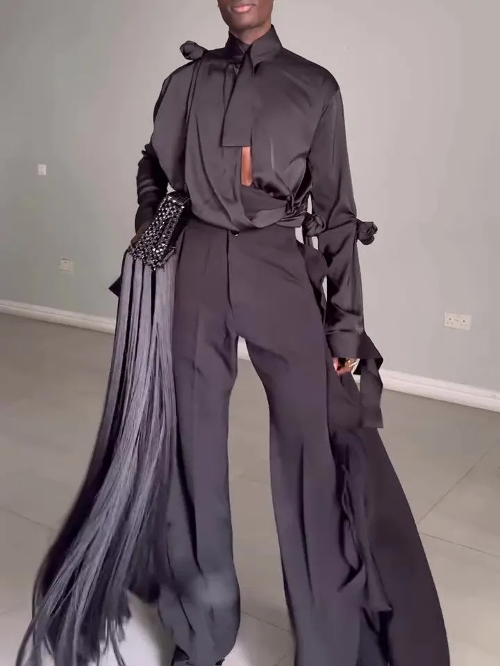 Men's black hollow cut out shirt and high waist pants suit set on display, polyester fabric, regular fit