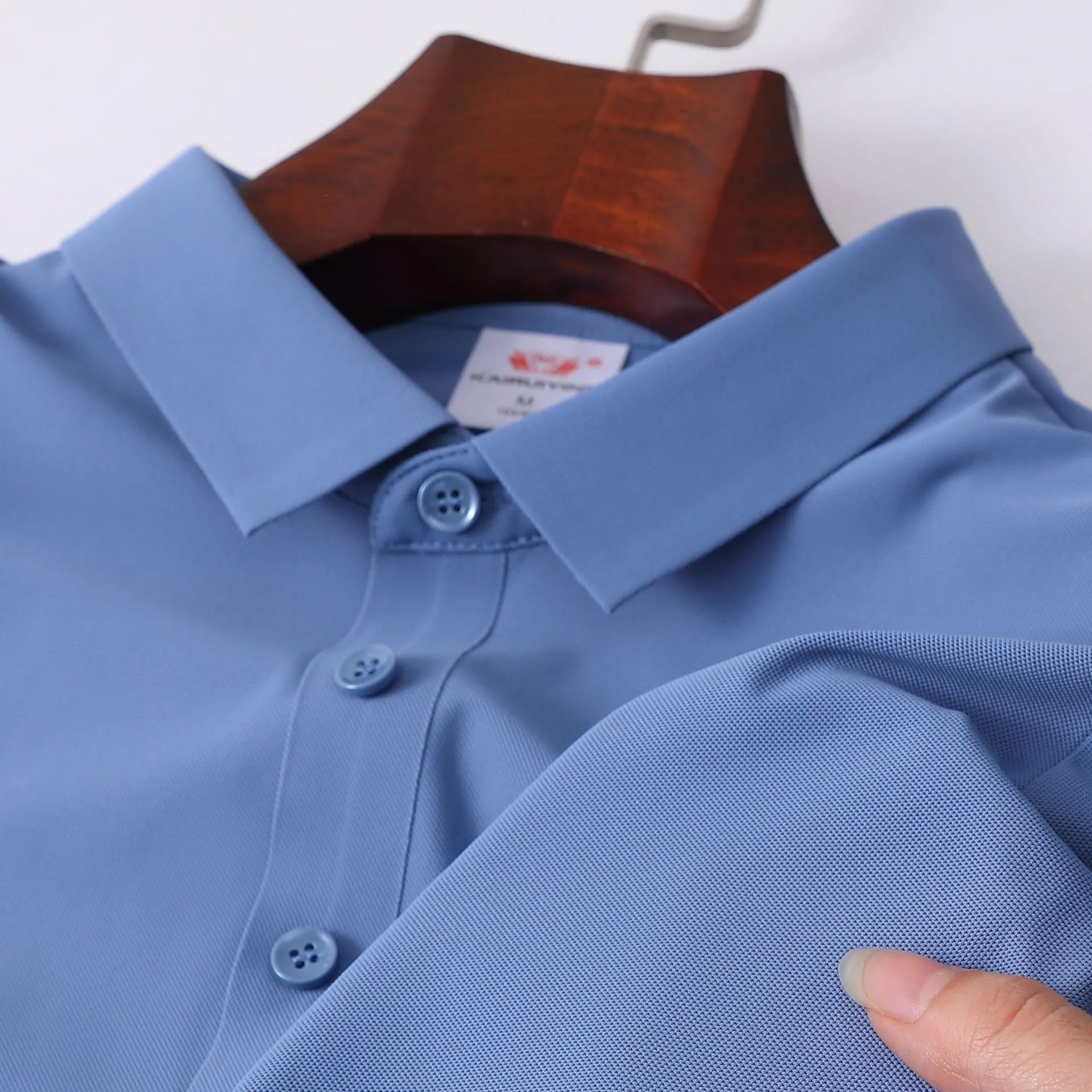 Men's ice silk seamless short sleeve polo shirt in solid colour, loose fit, nylon fabric, side view