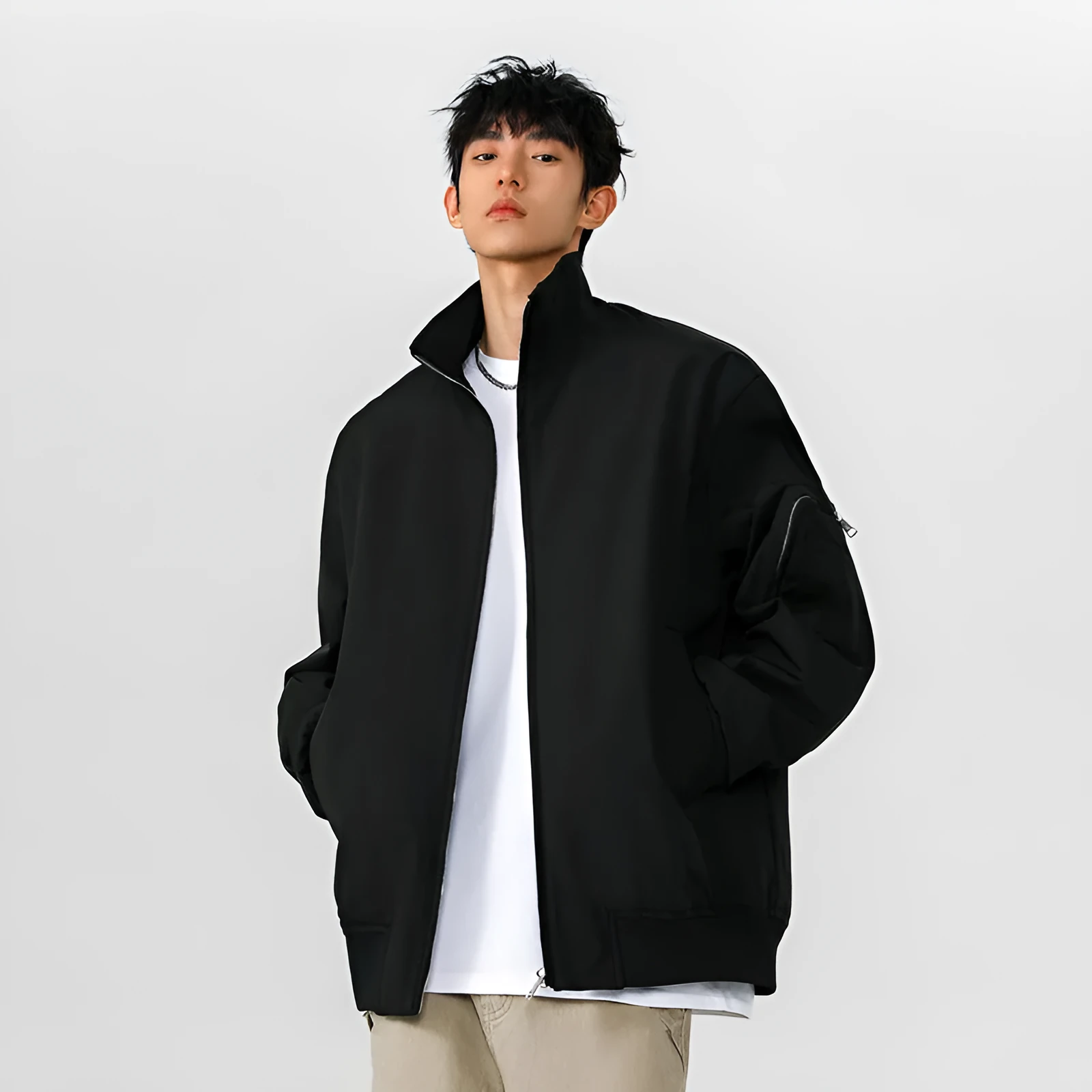 Men's large size multi-pocket short flight jacket in black, loose fit, polyester fiber fabric with visible pockets.