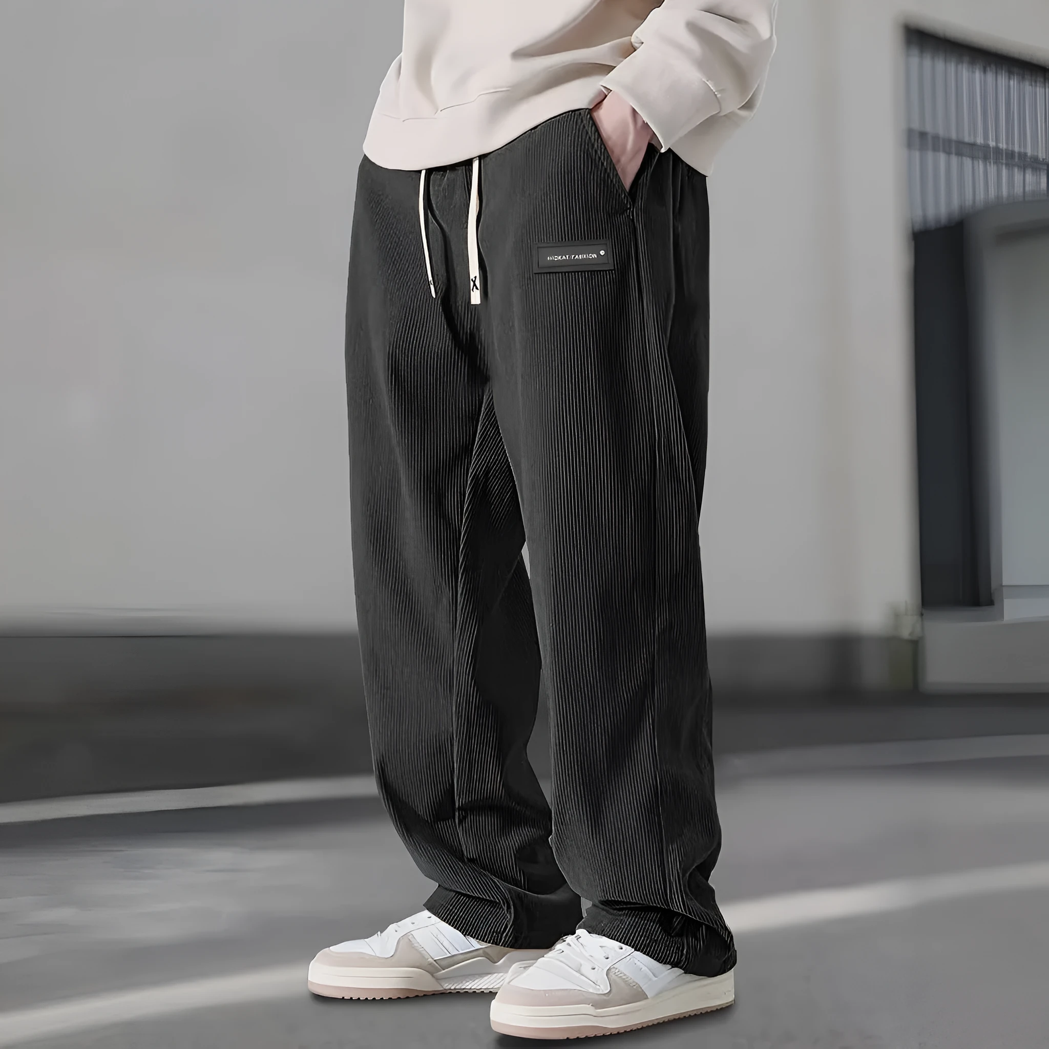 Men's corduroy straight-leg trousers in khaki with drawstring waist on a model, front view