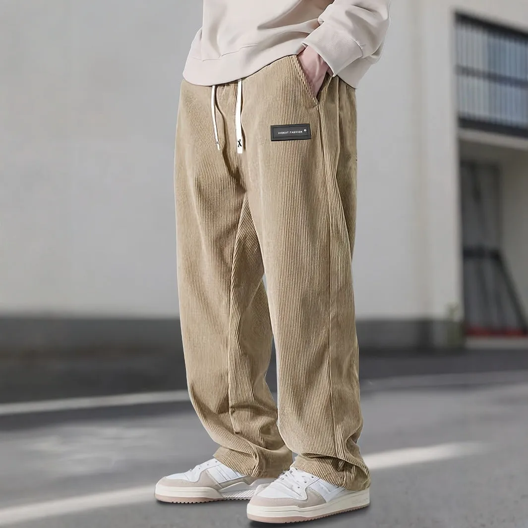 Men's corduroy straight-leg trousers in khaki with drawstring waist on a model, front view