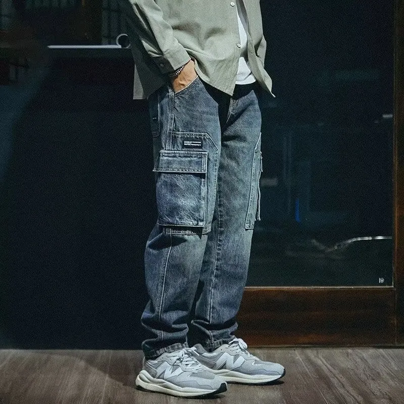 Man wearing blue loose straight-leg retro jeans with a zip fly, showcasing the casual fit.