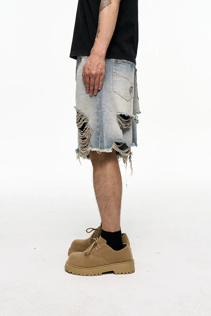 Light blue washed denim shorts with a baggy wide-leg fit and mid-waist on a mannequin.