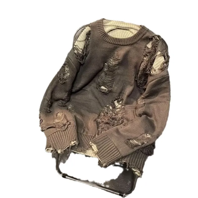 Men's black ripped pullover sweater with animal pattern and tassels on gray background