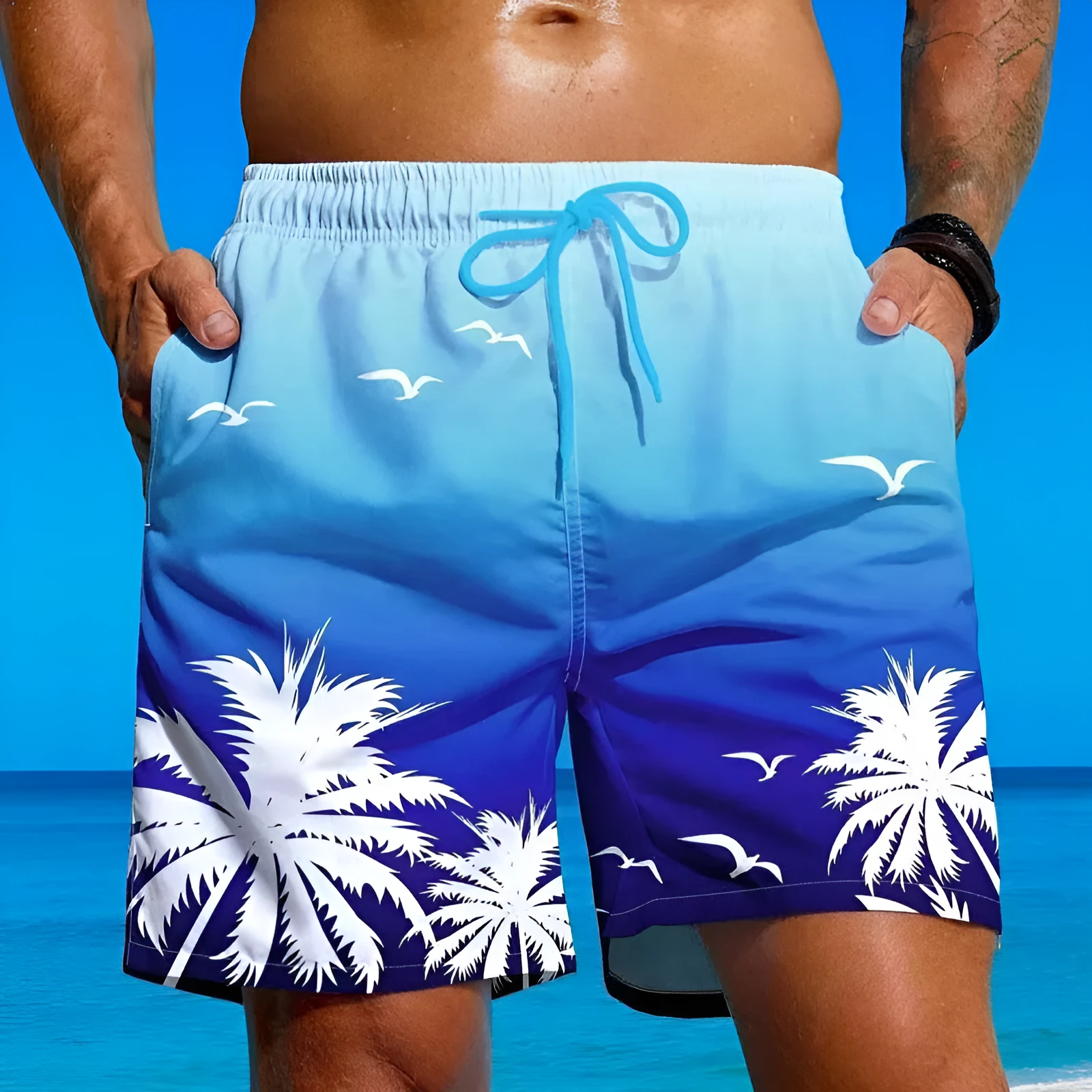 Man wearing ethnic pattern loose board swim shorts in polyester fabric by the pool.