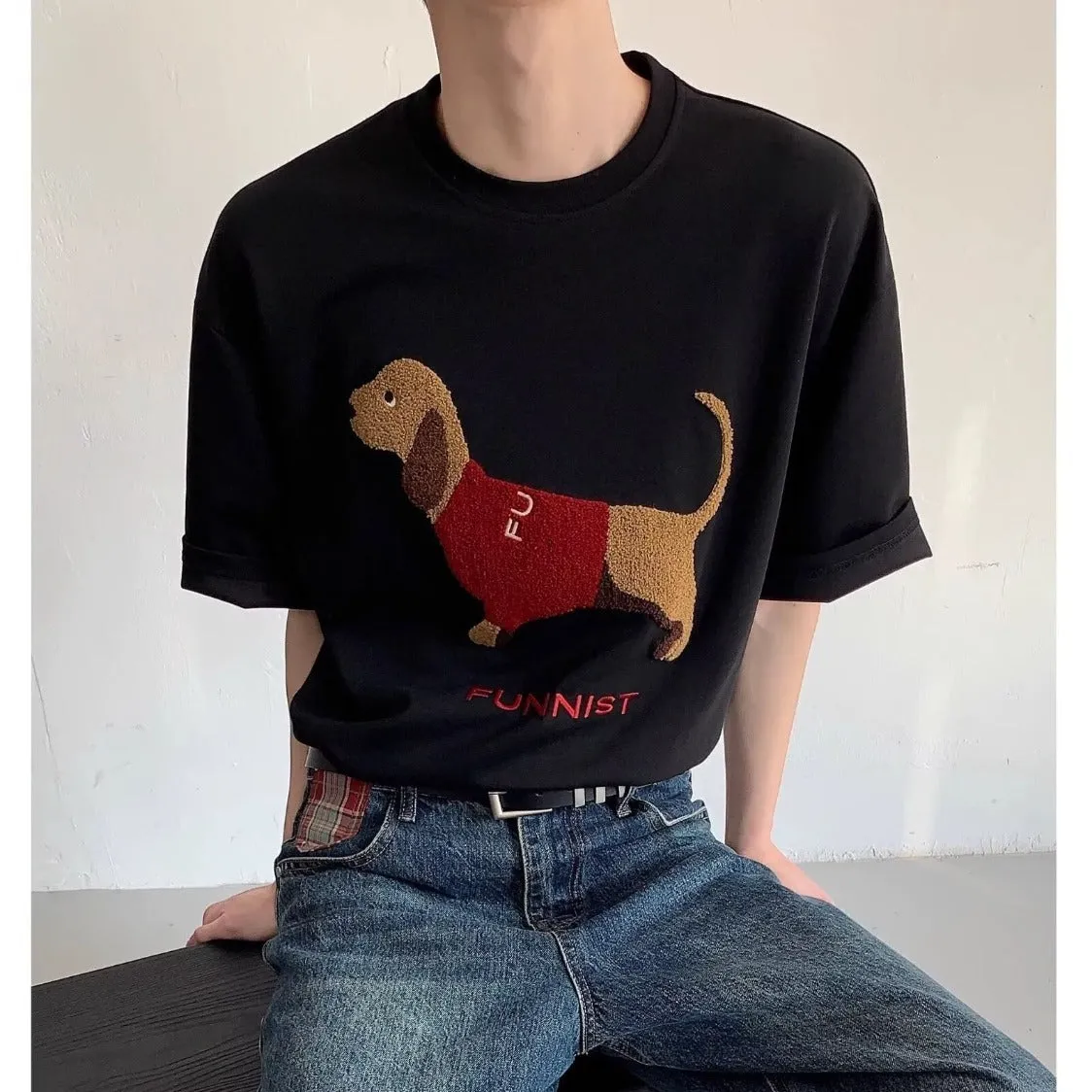 Men's gray cotton t-shirt with an embroidered cartoon sausage dog holding a blue towel.