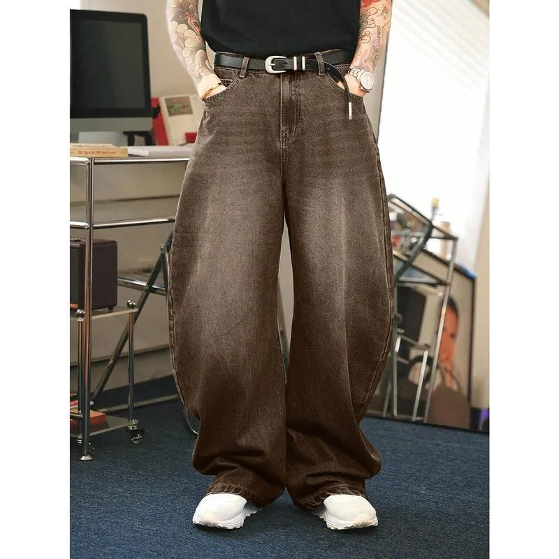 Men's brown washed loose flared jeans with low waist and zipper fly, side view