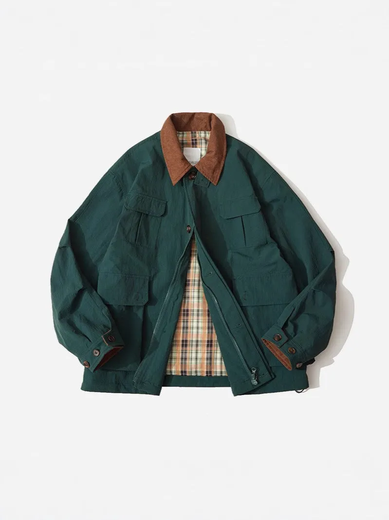 Green and apricot contrast colour casual jacket with side seam pockets on a hanger