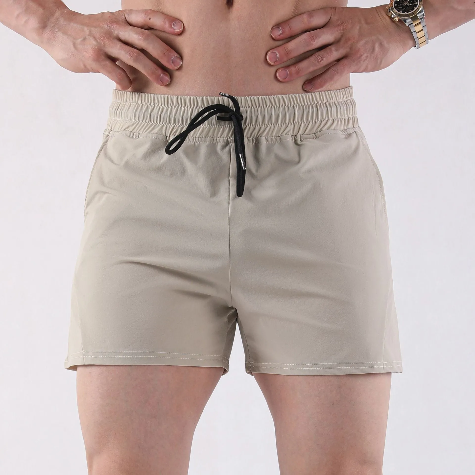 Men's thin grey polyester basketball shorts with elastic waistband for summer sports activities