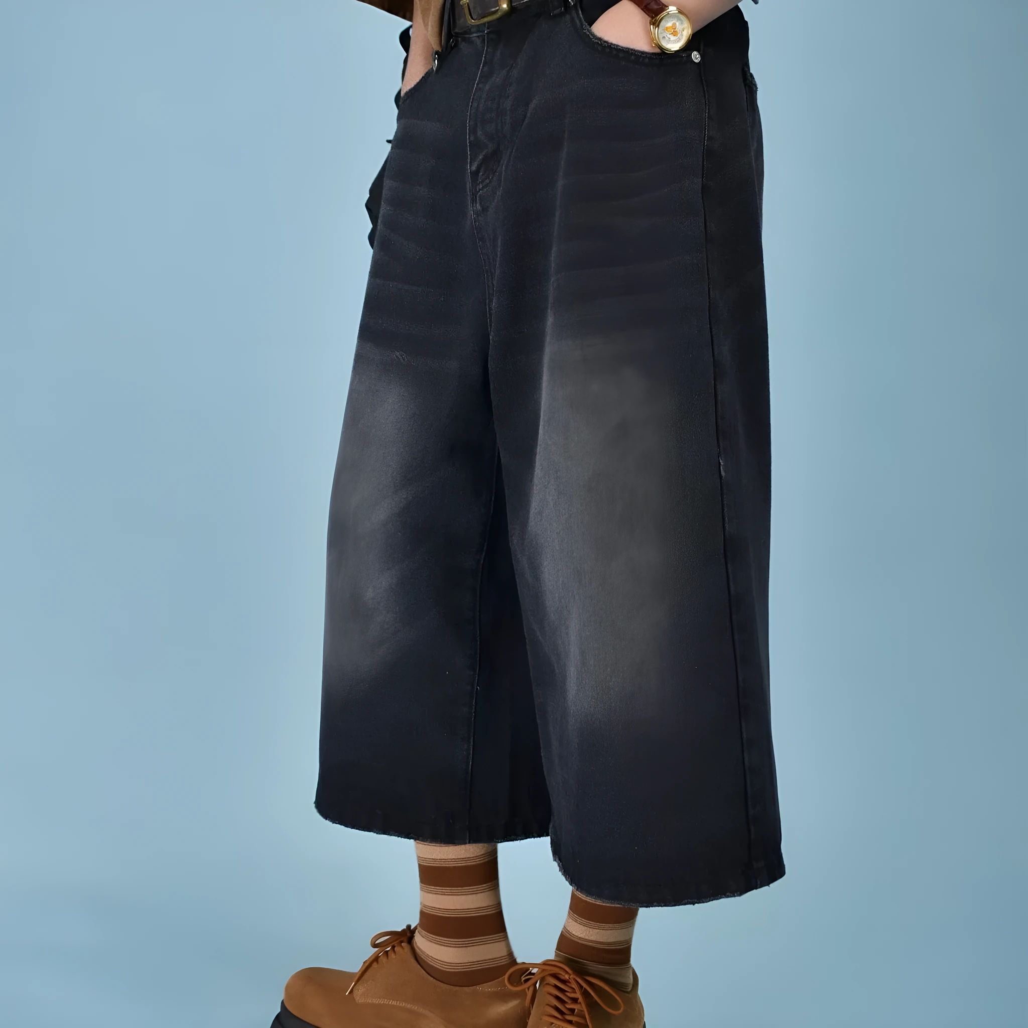 Men's loose fit straight leg denim shorts in blue, shown at a fifth pants length.