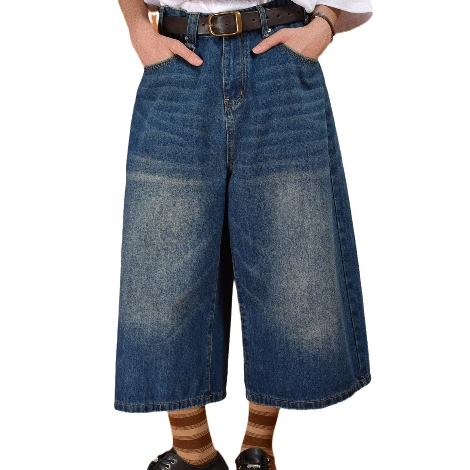 Men's loose fit straight leg denim shorts in blue, shown at a fifth pants length.