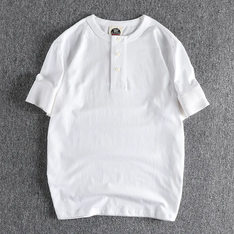 Men's combed cotton Henry collar short sleeve t-shirt in solid colour with cuffed wide-brimmed sleeves, straight fit, retro washed finish