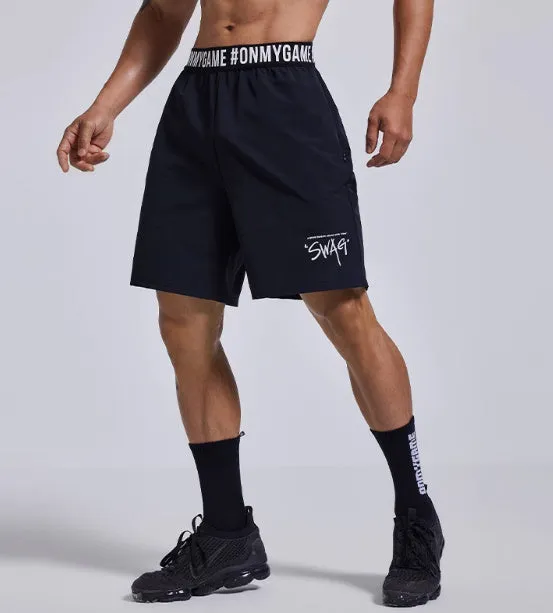 Men's loose black sports shorts with an elastic waistband and printed letter design.