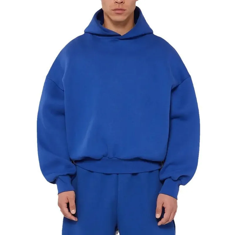A man's solid-colour fleece-lined cotton hoodie with a wool interior, shown in a casual setting.