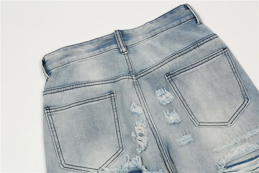 Men's light blue flared washed denim jeans with zipper fly on a model