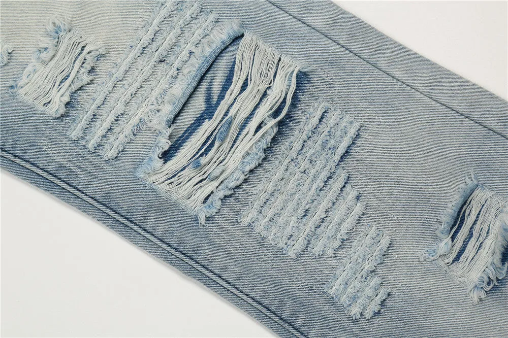 Men's light blue flared washed denim jeans with zipper fly on a model