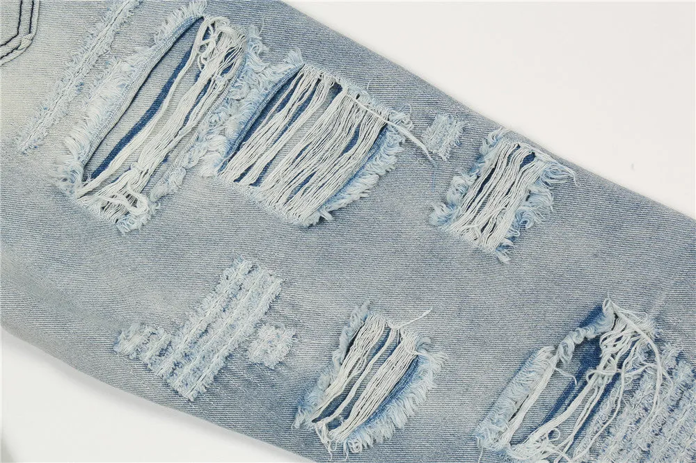Men's light blue flared washed denim jeans with zipper fly on a model