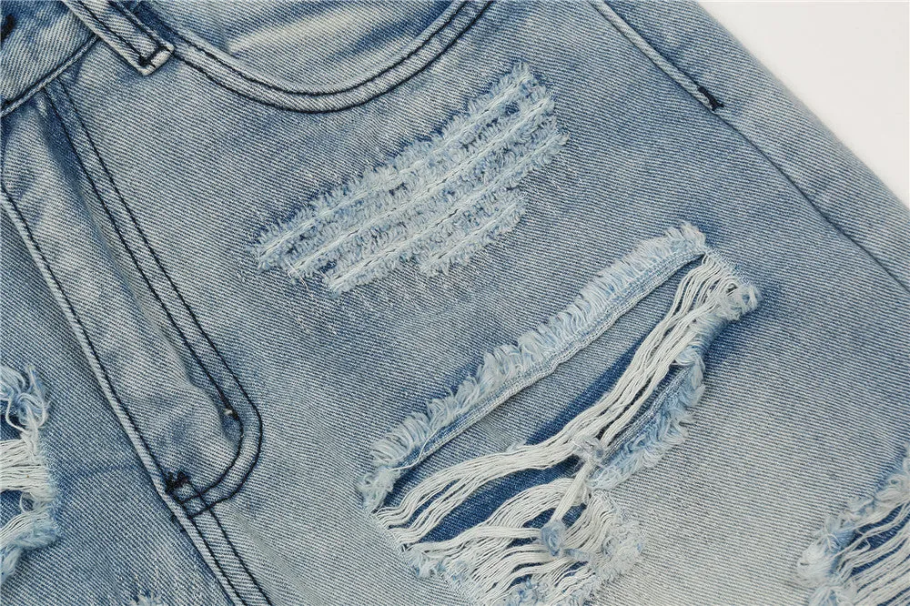 Men's light blue flared washed denim jeans with zipper fly on a model