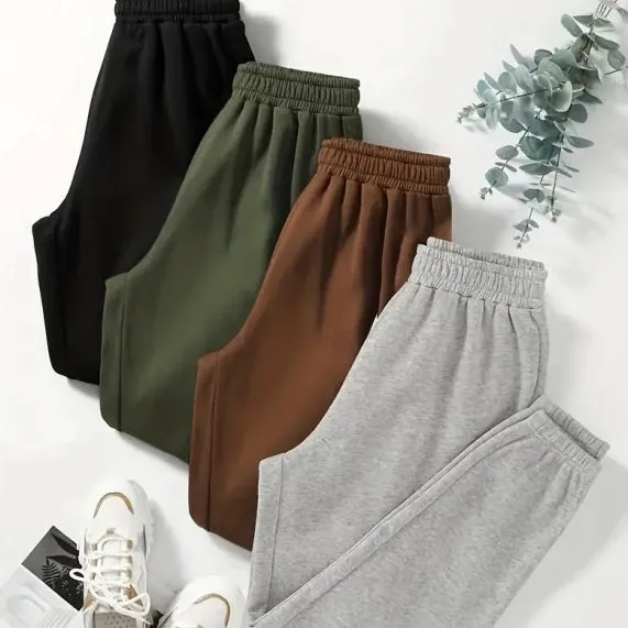 Four women's polyester sweatpants in black, green, brown, gray, stacked together